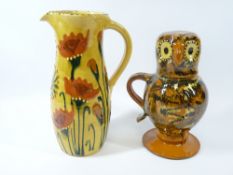 SLIPWARE POTTERY JUGS (2) including 'Ozzy The Owl' example, the head formed as a cup, the other