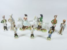 CONTINENTAL PORCELAIN MILITARY FIGURINES and a similar lady and gent on horseback, a pair