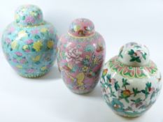 THREE MODERN CHINESE FAMILLE ROSE PORCELAIN JARS & COVERS, variously decorated with lotus,