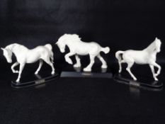BESWICK POTTERY HORSES (3) - in matt white on titled wooden bases to include 'Spirit of The
