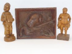 RUSTIC DEEP CARVED GUN DOG WITH GAME PANEL and two standing figurines of a young boy with