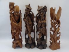 CHINESE & OTHER WOOD CARVINGS (4) - depicting two elderly pipe smoking men, a bearded figure with