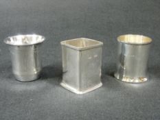 TWO SILVER BOTTLE HOLDERS - 1. Plain square, Birmingham 1943, 3ozs, 7cms H and, 2. Plain circular,