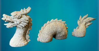 GARDEN STONEWARE - reconstituted statuary of a writhing dragon in three sections, 45cms H the head