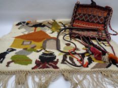 TRIBAL WOOLWORK WALL HANGING, vintage carpet type bag and a leather whip, 120 x 84cms the wall