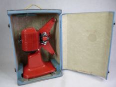 A CASED CIRSE CINE CAMERA IN RETRO RED - in its carrying case in working order