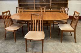 G-PLAN DINING TABLE & SIX CHAIRS - light wood, the table extending with flip-out leaf, 73cms H,