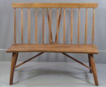 RUSTIC BENCH with walnut seat and spindleback, 108cms H, 127cms W, 47cms D