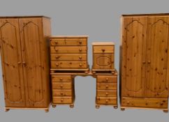 MODERN PINE BEDROOM FURNITURE comprising two wardrobes, one with base drawer, both 178cms H, 87cms