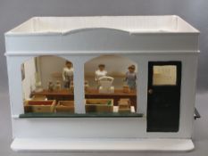MID 20TH CENTURY FOLK ART MODEL OF A GROCER'S SHOP - complete with three carved ladies, boxes of