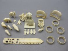 LATE 19TH/EARLY 20TH CENTURY ANGLO INDIAN IVORY/BONE CARVINGS - an elephant with palanquin on a