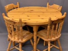 MODERN CIRCULAR TOP PINE TABLE & FOUR FARMHOUSE CHAIRS with turned spindle backs, 77cms H, 109cms