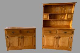 MODERN PINE DRESSER - the base with fielded panels and two drawers over two doors, with a two
