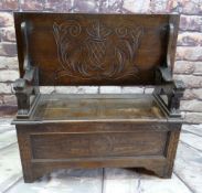 REPRODUCTION OAK MONK'S BENCH, lions carved arms and carved shiled top, 107cms wide