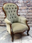 VICTORIAN WALNUT BALLOON BACK ARMCHAIR, button upholstered in olive green velour, scrolled back