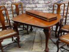 VICTORIAN STYLE EXTENDING DINING TABLE and SEVEN CHAIRS, with gadroon moulded top and leaf capped