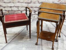 A NEST OF THREE WALNUT OCCASIONAL TABLES with carved edges, legs, claw & ball feet, and a