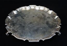 GEORGE VI SILVER WAITER, Birmingham 1937, with pie-crust rim on three scrolled feet, 21cm diam,