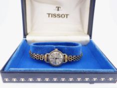 LADIES TISSOT WRISTWATCH, the bricklink bracelet marked 9ct gold, in vintage blue Tissot rectangular