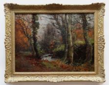JOHN CUTHBERT SALMON RBA RCA oil on canvas - autumnal woodland with stream, signed, 45 x 60cms