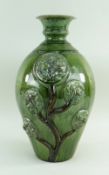 A EWENNY SLIPWARE POTTERY TREE OF LIFE VASE of baluster form with flared bottle neck, the body