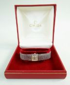 OMEGA 9CT WHITE GOLD LADIES WRISTWATCH, the inside back cover marked 'Omega Watch Co' and numbered