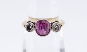18CT GOLD PINK SAPPHIRE & DIAMOND RING, the central pink sapphire (6 x 5mms approx.) flanked by