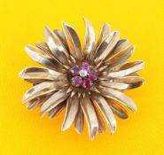 YELLOW METAL DIAMOND & RUBY FLORAL BROOCH, the small central diamond surrounded by five rubies, 16.