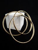 THREE YELLOW METAL BANGLES, 59gms overall (3) Auctioneer's Note: vendor had these made out of a