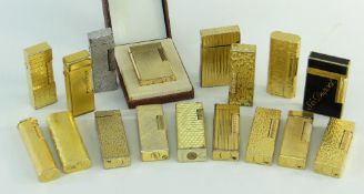 COLLECTION OF CARTIER, DUNHILL & DUPONT CIGARETTE LIGHTERS, mostly gold plated with various textured