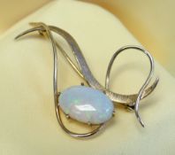 9CT GOLD OPAL BAR BROOCH of flowing loop design, the oval opal measuring 15 x 9mms, 3.9gms, in