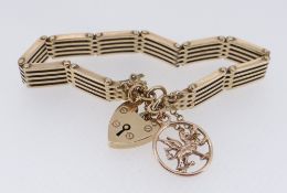 9CT GOLD GATE BRACELET, with 9ct gold Welsh dragon charm, yellow metal Celtic Knot charm, 30.6gms