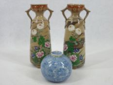 A BLUE FLORAL DECORATED ARITA GLOBULAR BOWL - with knopped lid, 9cms diameter, 7cms H together