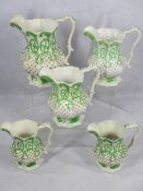 19TH CENTURY GRADUATED JUGS (5) - possibly Llanelly, relief moulded with cameo type ovals and leaf