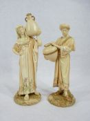 ROYAL WORCESTER FIGURINES, A PAIR - depicting male and female water carriers, Model Nos 1250,
