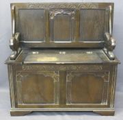 PRIORY STYLE OAK MONK'S BENCH - the lidded box seat with lion carved arms, 71.5cms H closed, 97cms H