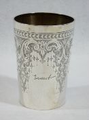 A SILVER BEAKER - slightly tapered with attractive scrolled and droplet decoration with