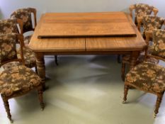 CIRCA 1900 OAK WIND-OUT DINING TABLE with two additional leaves, the top with cut-off corners, on