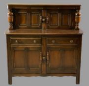 ERCOL OAK BUFFET SIDEBOARD with twin upper cupboard doors and bulbous top support detail over a base