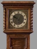 VINTAGE OAK GRANDMOTHER CLOCK having pierced gilt spandrels and silvered chapter ring to the dial,