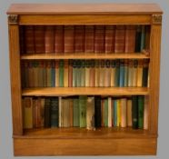 REPRODUCTION MAHOGANY BOOKCASE and books (as displayed), 92.5cms H, 91cms W, 29cms D