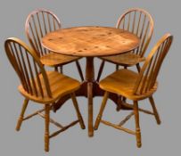 MODERN PINE CIRCULAR PEDESTAL TABLE, 73cms H, 91cms diameter and four light wood spindleback