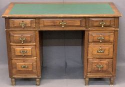 NEATLY PROPORTIONED TWIN PEDESTAL DESK - having inset green leatherette surface over three frieze