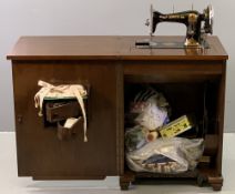 VINTAGE SEWING CABINET with Jones hand crank sewing machine and haberdashery contents, 80cms H,