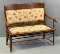 VINTAGE BENCH - two seater with carved detail and upholstery to the back, upholstered seat, on