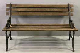 GARDEN BENCH with cast metal ends and wooden slats, 69cms H, 123cms W, 55cms D
