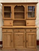 FARMHOUSE PINE TYPE DRESSER with upper glazed doors and central shelves over a three door and drawer