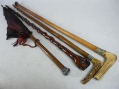 SILVER MOUNTED PARASOL, a 19th century clasped hand walking stick and two antler handled sticks