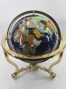 MODERN GEMSTONE GLOBE - in a brass effect gimbal stand, 50cms H, 43cms diameter approximately the