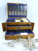 OAK CASED TABLE CANTEEN OF CUTLERY, one hundred piece, within a fitted lidded top and two drawers